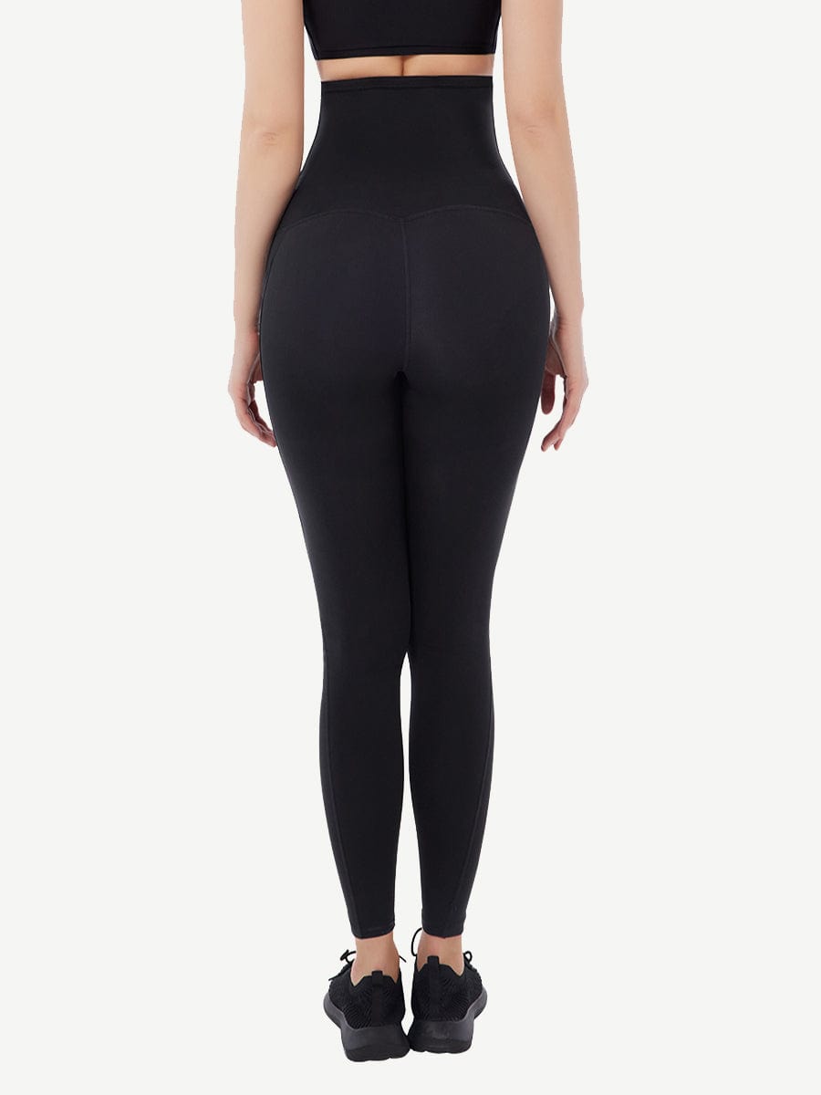 a woman in a black sports bra top and leggings