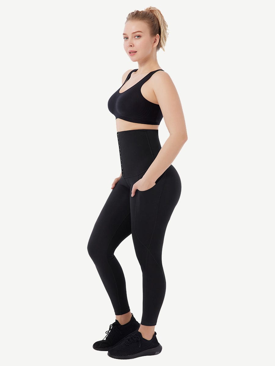 a woman in a black sports bra top and leggings