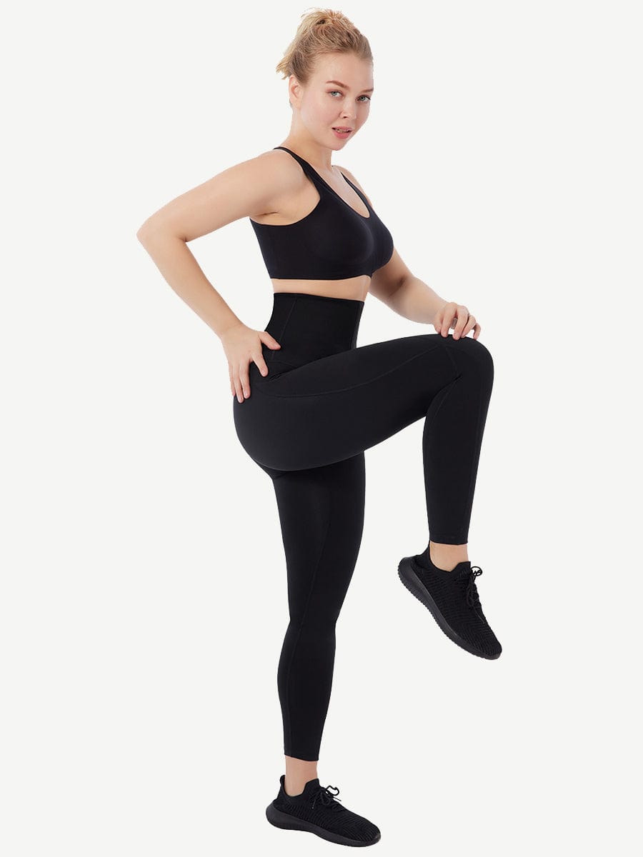 a woman in a black sports bra top and leggings