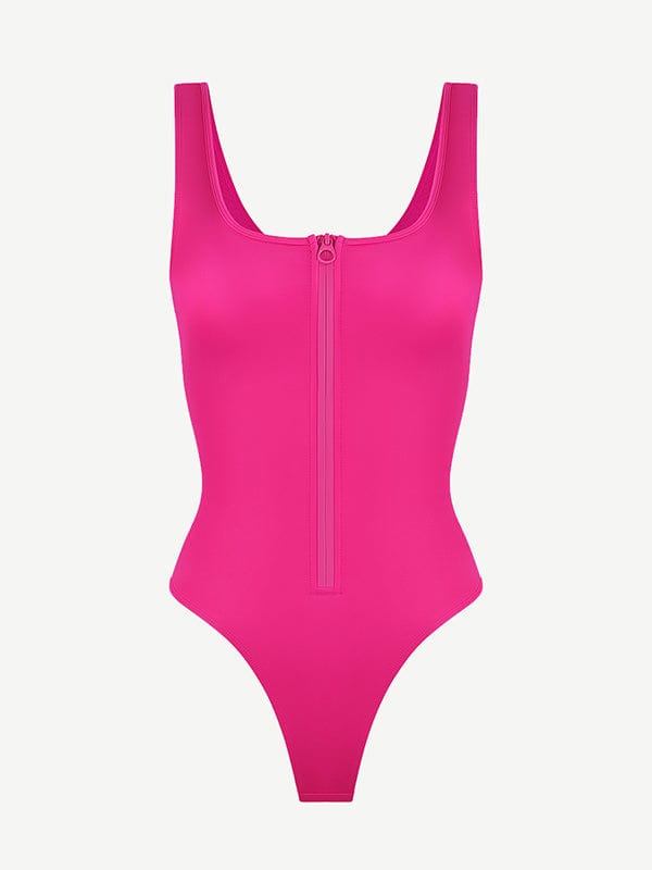 a woman in a pink swimsuit with zippers