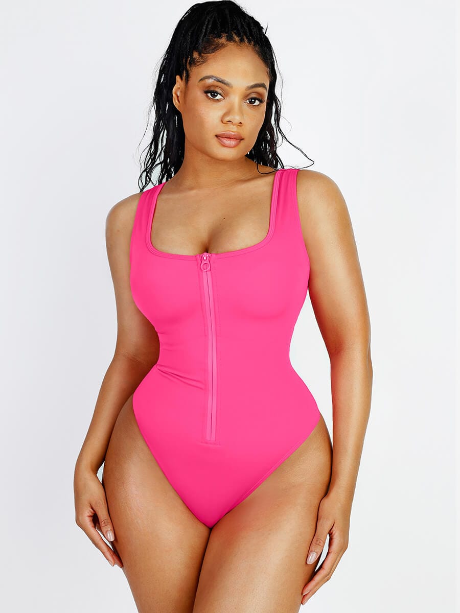 a woman in a pink swimsuit posing for a picture