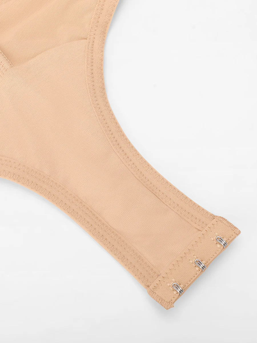 Beige bra strap with metal grommets on a white background