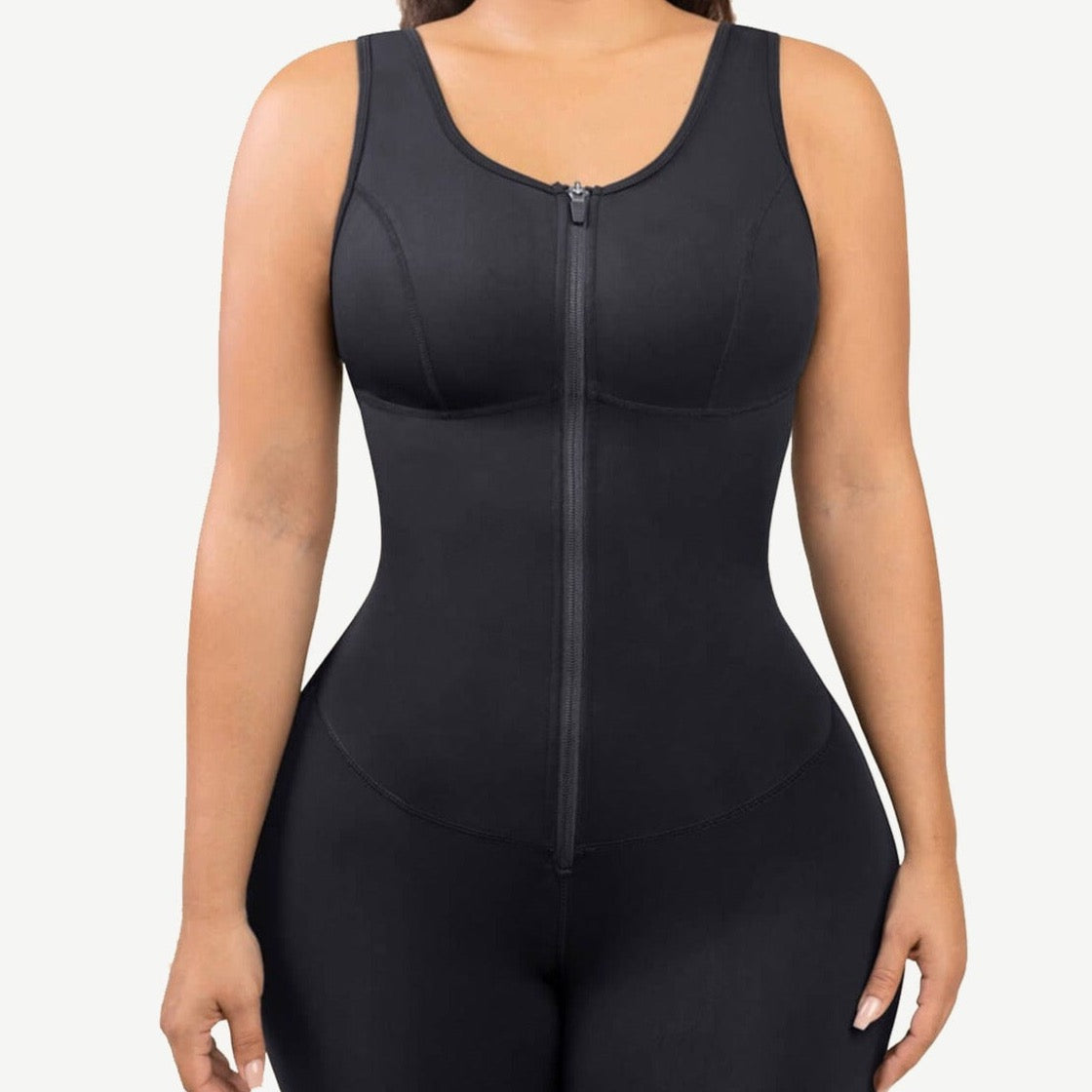 a woman wearing a black bodysuit with zippers
