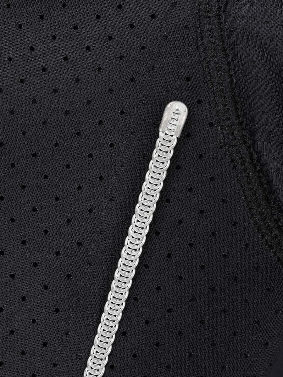 a close up of a black jacket with a white zipper